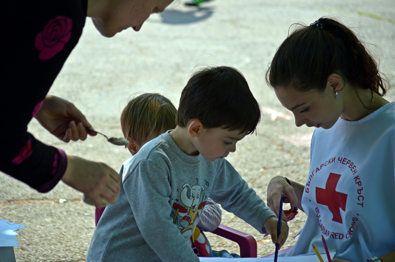 boys, pencil, daytime, red cross, togetherness, lifestyles, men, leisure activity, volunteer, holding, help, offspring, gray, outdoors, t, woman, real people