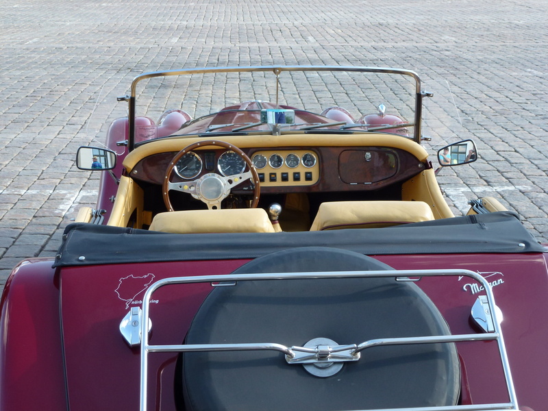 transportation, car show, wheel, sports car, city, retro styled, steering wheel, land vehicle, day, mode of transportation, no people, car, suitcase, road
