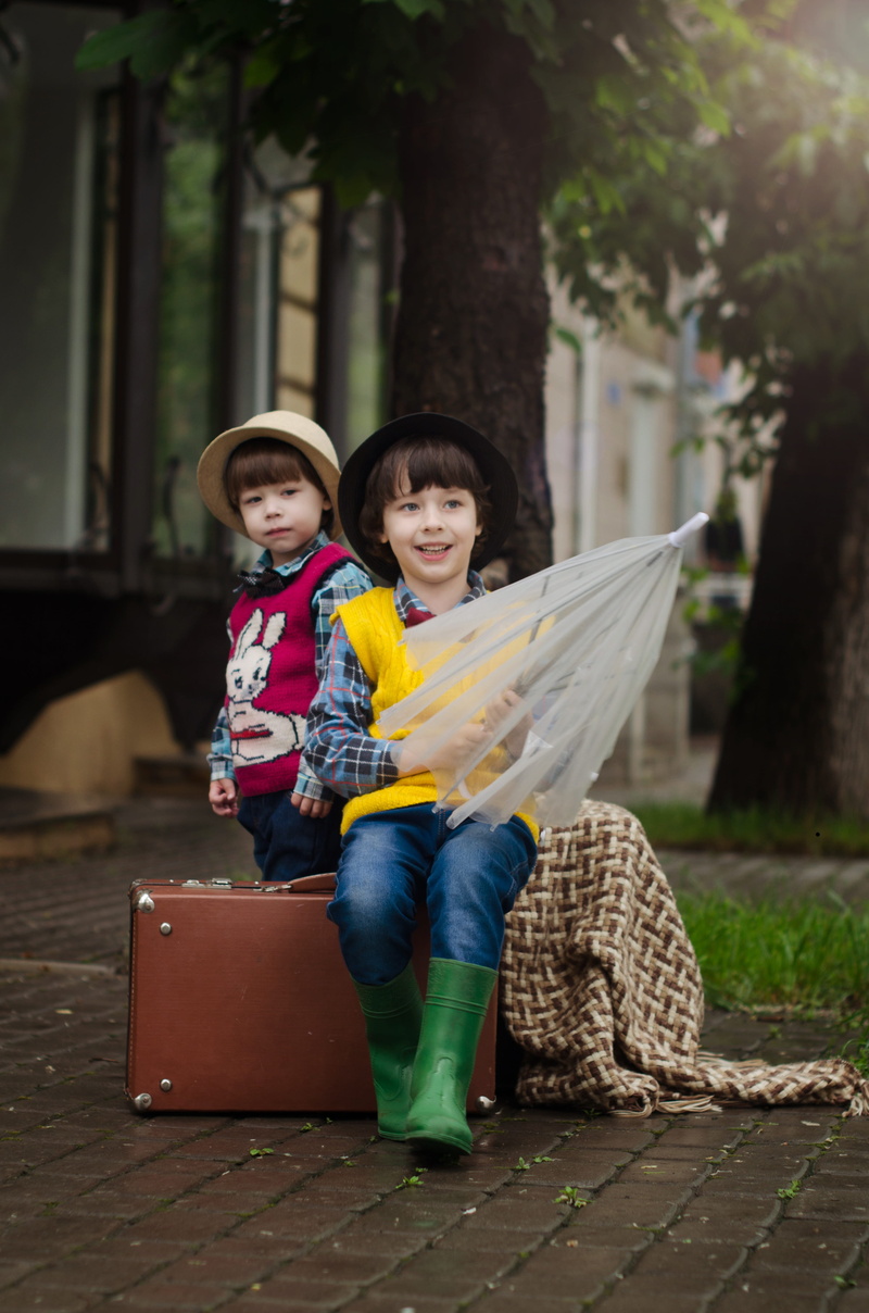 baby, males, luggage, outdoors, kids, smile, views, real people, kid, casual clothing, umbrella, two people, child, men, looking at camera, weather, street