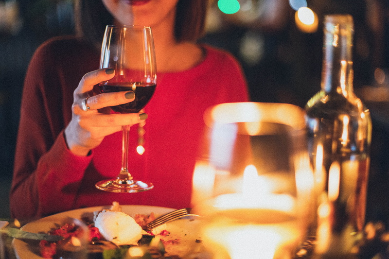 one person, drinking glass, alcohol, bar counter, liquor, food and drink, adult, 5K, focus, wine bottle, candle, selective, celebration, toast, blur, indoors