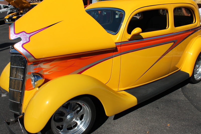 chrome, wheel, vintage, stationary, personal land vehicle, drive, mechanic, yellow taxi, maintenance, orange color, custom design, land vehicle, mode of transportation