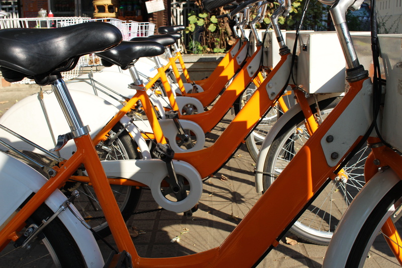 transportation, stationary, mode of transportation, wheel, hire, active, city, outdoor, rent, adventure, land vehicle, orange color, motor vehicle, absence