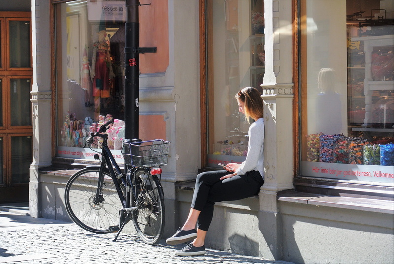 sitting, one person, stockholm, leisure activity, relax, summer, real people, seat, transportation, hair, casual clothing, hairstyle, full length, day