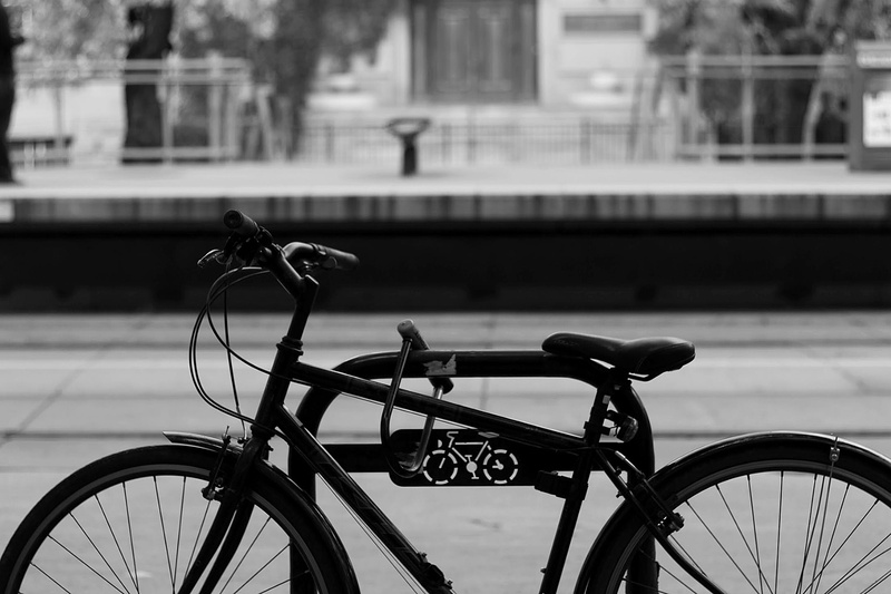 safety, 1080P, building exterior, wheel, fence, mode of transportation, lock, no people, stationary, security, built structure, bicycle rack, architecture