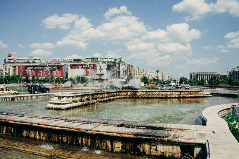 people, palace, water, touristic, building, jets, blue, connection, built structure, capital, town, buildings, bridge, outdoors, romanian, building exterior