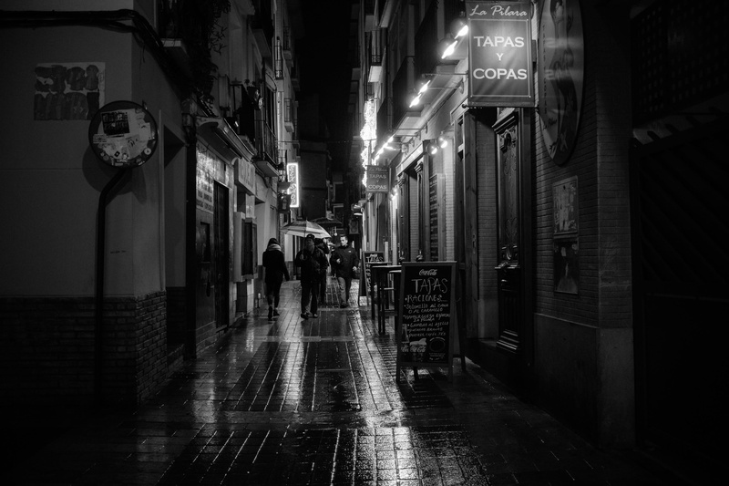 alley, rain, sign, black and white, wet, city, building exterior, text, rainy, the way forward, walking, city life, 2K, zaragoza, illuminated, restaurant