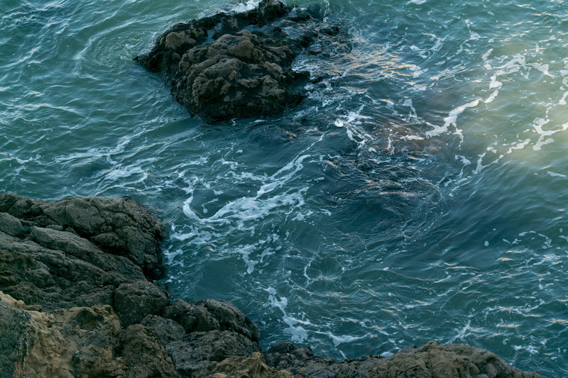rock - object, tranquility, flotsum, turbid, waterfront, lake, light, sea, power in nature, nature, water, ocean, cold, swirling, solid, foam, land, rock formation