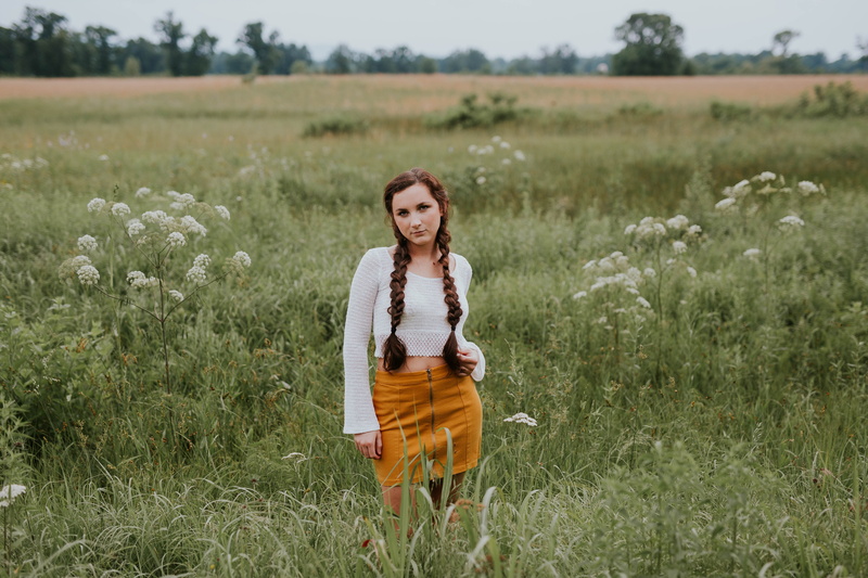 smiling, nature, hairstyle, one Person, lifestyles, sleeve, plant, hair, green, looking at camera, people, green field, caucasian Ethnicity, mini, white