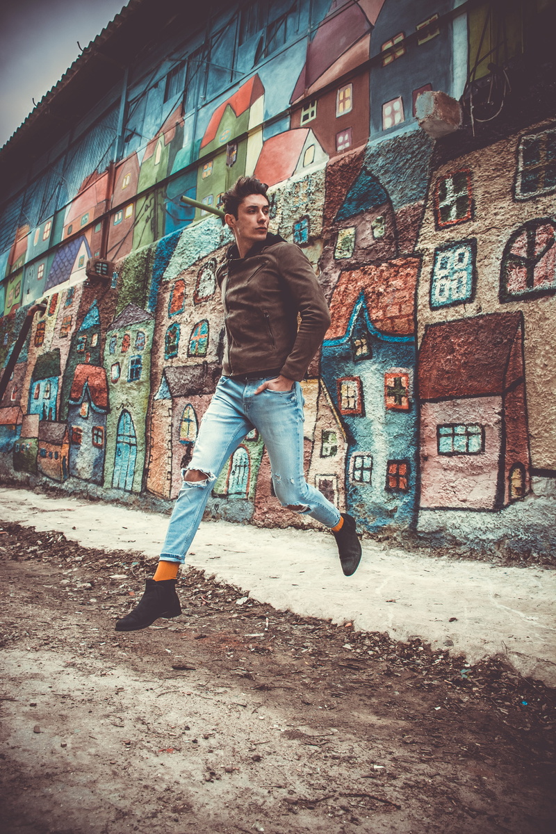 man, 5K, leisure activity, streetwear, people, orange sock, young, city, street style, graffiti, outdoors, painting, real people, adolescence, human, built structure