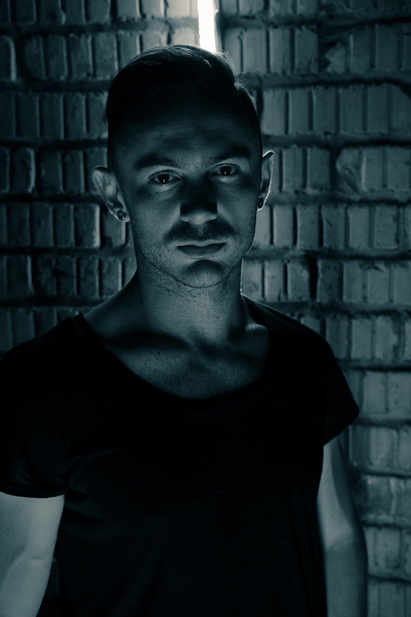 looking at camera, scoop, face, men, short, 5K, dark, building, headshot, one person, top, young men, lifestyles, portrait, clothing, human face, street