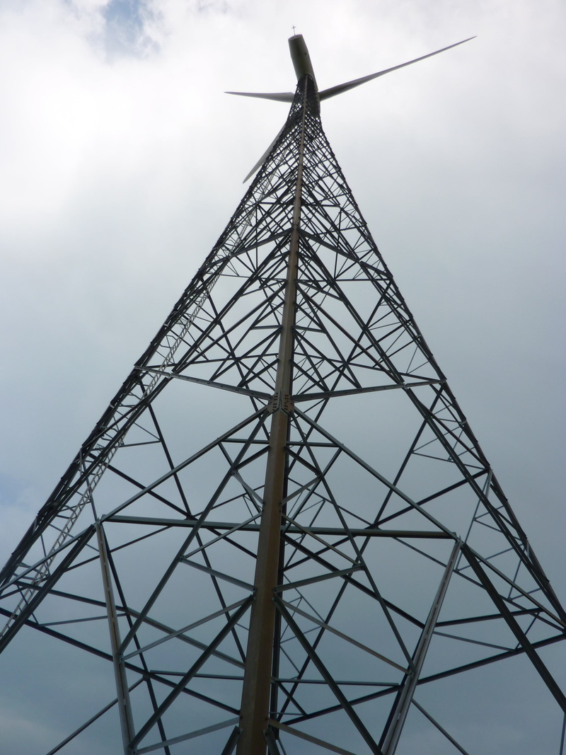 structure, renewable energy, pinwheel, dark clouds, directly below, outdoors, power supply, connection, cloud - sky, tall - high, low angle view, turbine