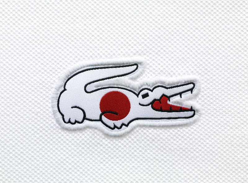 creativity, crocodile, indoors, patch, no people, single object, directly above, white, 2K, white color, representation, simplicity, Lacoste, red, flag