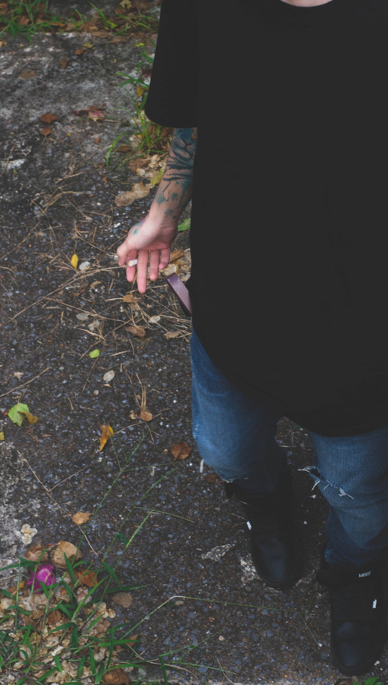 dirt road, arm, leaves, plant, 4K, hand, nature, low section, body part, denim, real people, leaf, human body part, lifestyles, asphalt, shoe, day, plant part