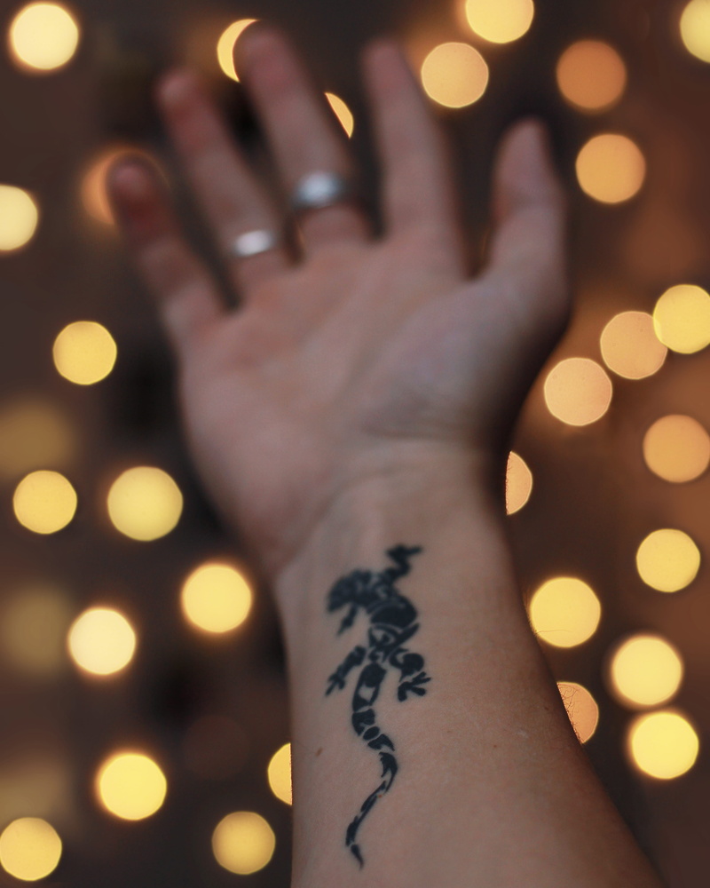 human, indoors, architecture, tower, lifestyles, bokeh, finger, spire, wrist, personal perspective, leisure activities, creativity, steeple, ampersand