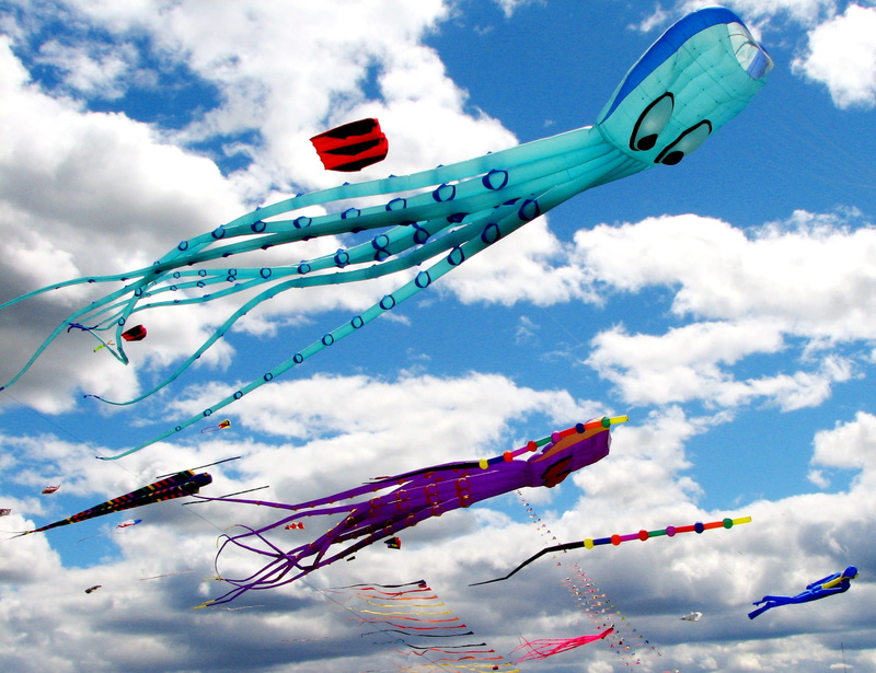 celebration, joy, toy, recreation, flying, kites, colorful, clouds, hanging, nature, fly, happy, streamer, environment, low angle view, kite - toy, blue