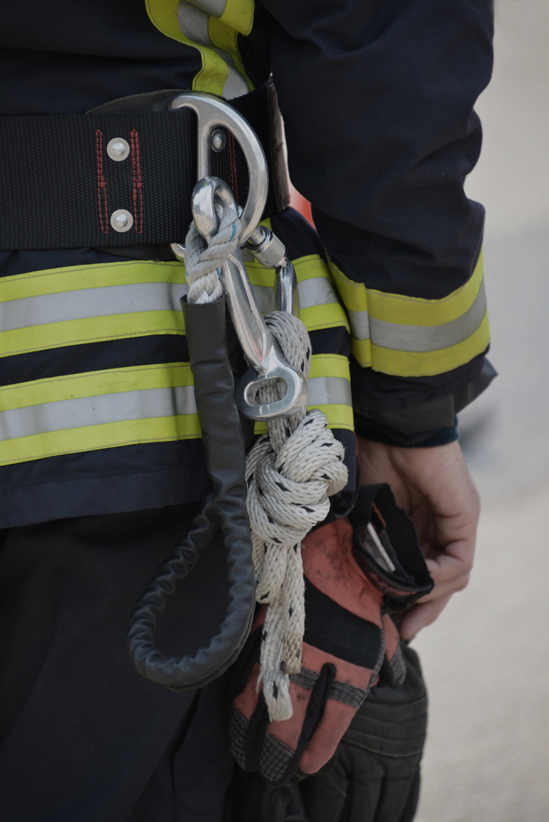 midsection, equipment, backup, people, outdoors, clothing, human body part, day, fire, safety, real people, delete, strength, standing, men, protective workwear