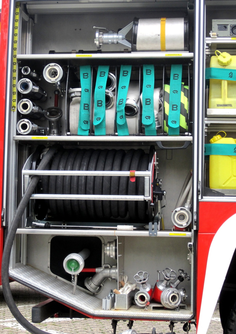 indoors, connection block, mode of transportation, hose, communication, transportation, fire truck, close-up, equipment, machinery, technology, metal, brand