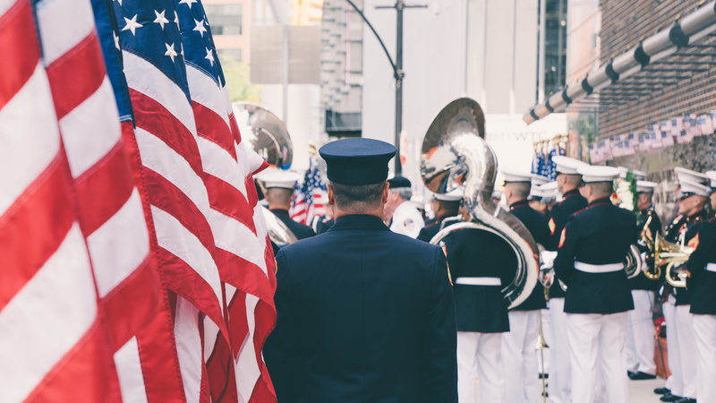 city, waist up, group of people, women, american, flag, architecture, taking, 9/11, rear view, government, crowd, day, focus on foreground, united state