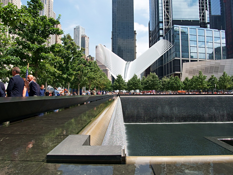 9/11, built structure, real people, city, office building exterior, skyscraper, outdoors, day, modern, nyc, nature, tree, building, united states, incidental people