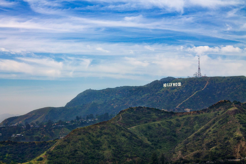 sky, outdoors, cloud - sky, no people, beauty in nature, mountain range, tranquility, green color, day, idyllic, tree, non-urban scene, mountain, hollywood