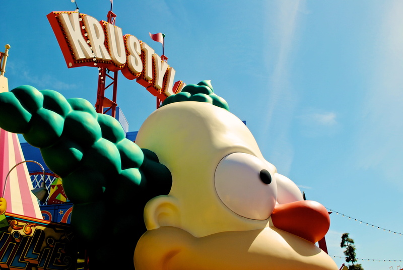 western script, universal studios hollywood, multi colored, celebration, universal city, text, cloud - sky, universal studios, blue, krusty, california