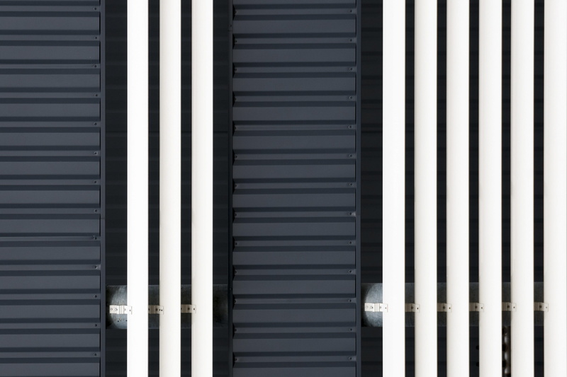 grey, wall - building feature, stripes, backgrounds, full frame, industrial, low angle view, outdoors, no people, day, blinds, vertical, white, repetition