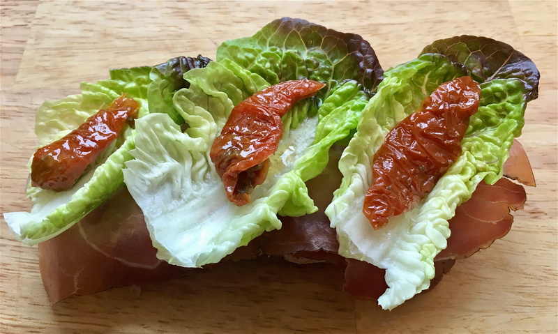 striations, food and drink, high angle view, food, wellbeing, fat, still life, wooden board, ham, salad, snack, freshness, tomatoes, open sandwich, leaves