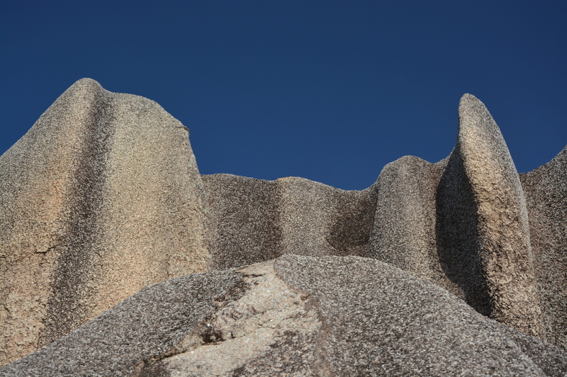 the past, stone figure, surface, sky, no people, outdoors, structures, sunlight, structure, land, duality, rock, history, built structure, travel, sand