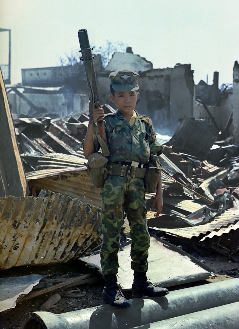 trooper, vietnamese child, uniformed soldiers, recruited by the army, architecture, kid, war, armed forces, 1968, young child, clothing, building, bombed houses