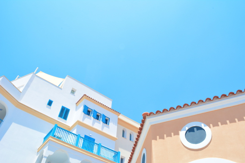 building, clear sky, residential, window, homes, no people, swimming pool, home, concrete, pastel, residential district, outdoors, building exterior, low angle view
