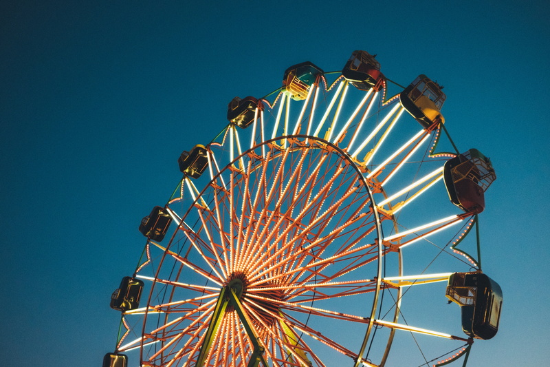 photo, outdoors, geometric shape, sky, wheel, arts culture and entertainment, fair, ride, fun, traveling carnival, carnival - celebration event, shape
