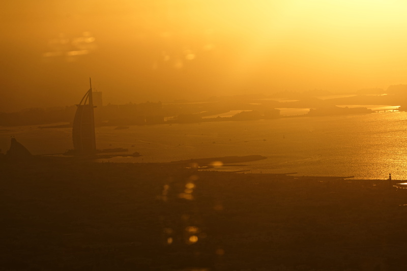 transportation, dubai, sunrise, tranquil scene, water, building exterior, burj al arab, nature, beauty in nature, cityscape, 5K, orange color, vehicle