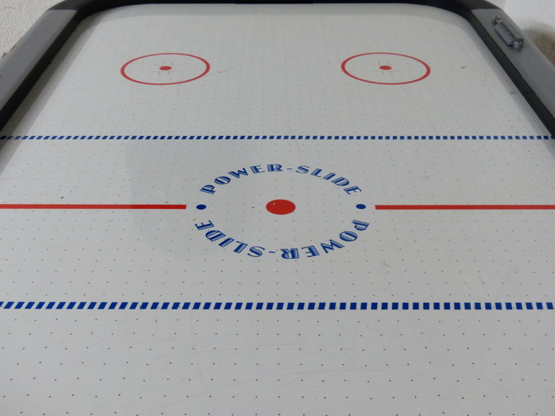 air nozzles, circle, bat, indoors, pattern, day, table hockey, discs, white color, hockey, no people, equipment, white, game table, table game, hockey table