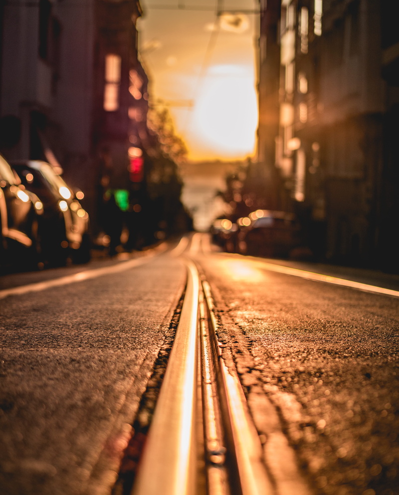 direction, evening sun, buildings, street, golden sunset, night, sun, architecture, public transportation, railway, transportation, asphalt, road, travel