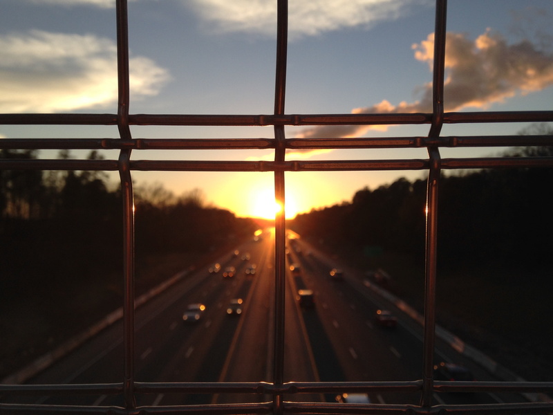 sunset, cars, road, railroad track, sun, outdoors, connection, twilight, glass - material, traffic, railing, view, nature, bars, way, dawn, track, transportation