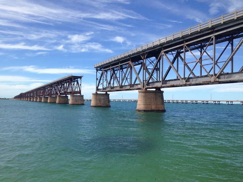 architectural column, sky, water, long, sea, built structure, connection, railway, waterfront, outdoors, day, bridge - man made structure, blue, nature