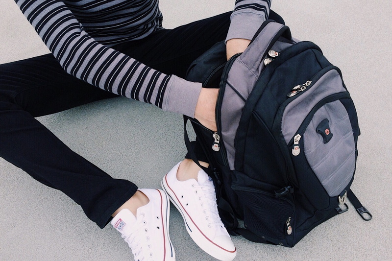 people, backpack, limb, person, student, clothing, lifestyles, high angle view, shoe, education, luggage, teenager, 2K, body part, inside, black color