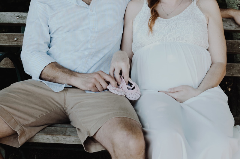 close, man, pregnant, bench, dress, holding, women, caucasian, sitting, adult, men, baby shoes, wife, booties, love, woman, photo, emotion, wedding, beside