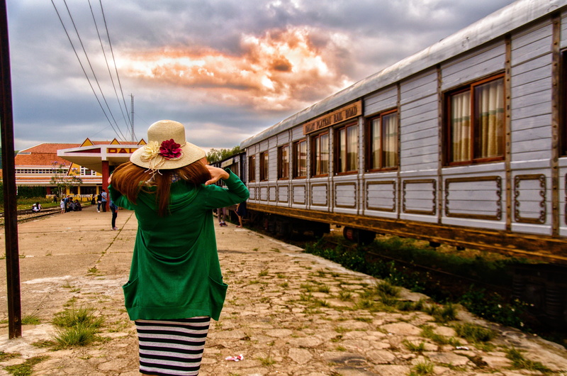 transportation, leave, mode of transportation, neck diameter, cloud - sky, track, women, train - vehicle, real people, sky, standing, travel, nature, waiting