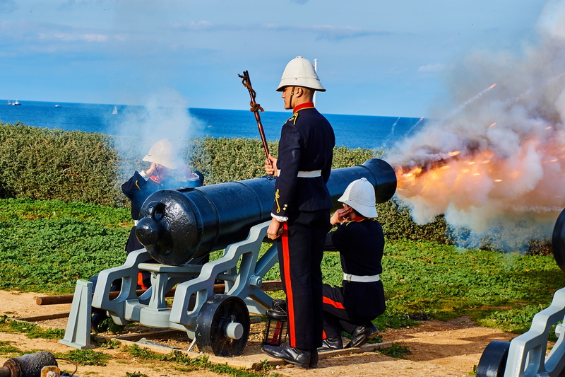 mode of transportation, people, shot, day, land, fire weapon, burning, field, malta, artillery, transportation, military, real people, outdoors, shoot