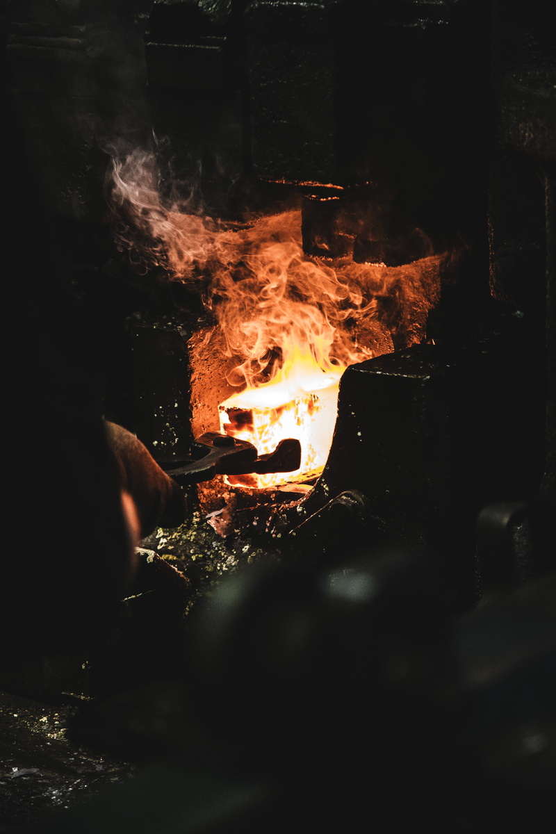 dark, night, heat, one person, glowing, log, close-up, sweden, wood, people, leisure activities, iron, fire, real people, bergsjö, orange color, fire - natural phenomenon