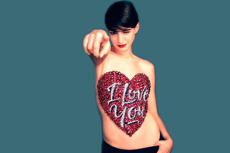 heart shape, front view, studio shot, lipstick, indoors, human body part, emotion, one person, photoshoot, copy space, positive emotion, women, young adult