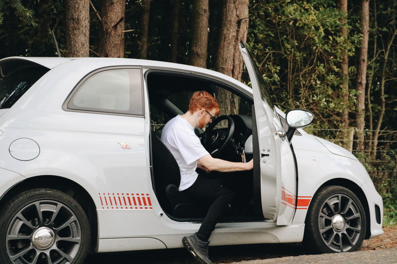 sports car, vehicle, full length, human, transportation, car, one person, side view, mature men, males, automobile, person, leisure activity, footwear