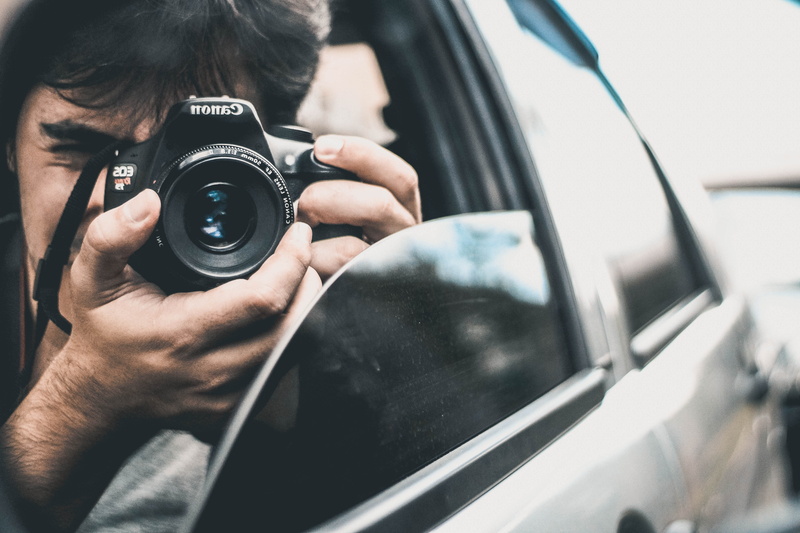 blur, one person, male, focus, slr camera, photography themes, capture, lens, inside, photography, motor vehicle, photographic equipment, close-up, car