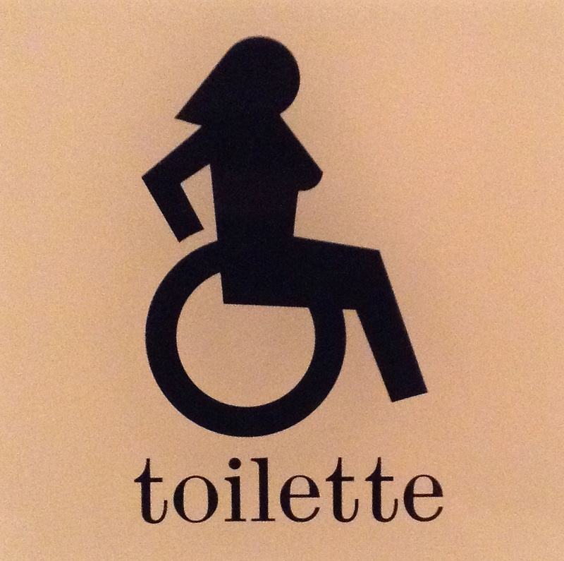 black color, equality, wall - building feature, colored background, day, human representation, symbol, close-up, no people, Wheelchair, communication, message