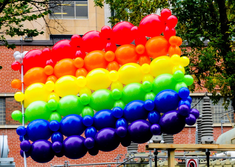 pride flag, festival, sunlight, built structure, variation, celebration, large group of objects, pride colors, food, food and drink, decoration, no people
