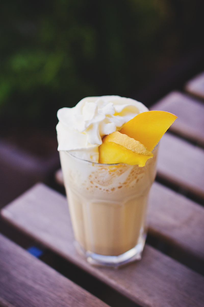 serving size, drinking glass, wellbeing, frappe, food, freshness, yellow, fruit, cream, focus on foreground, temptation, cafe, outdoors, food and drink
