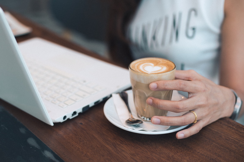 mug, coffee, coffee - drink, person, ring, human body part, communication, glass, white, computer, drinking, beside, technology, office, business, laptop