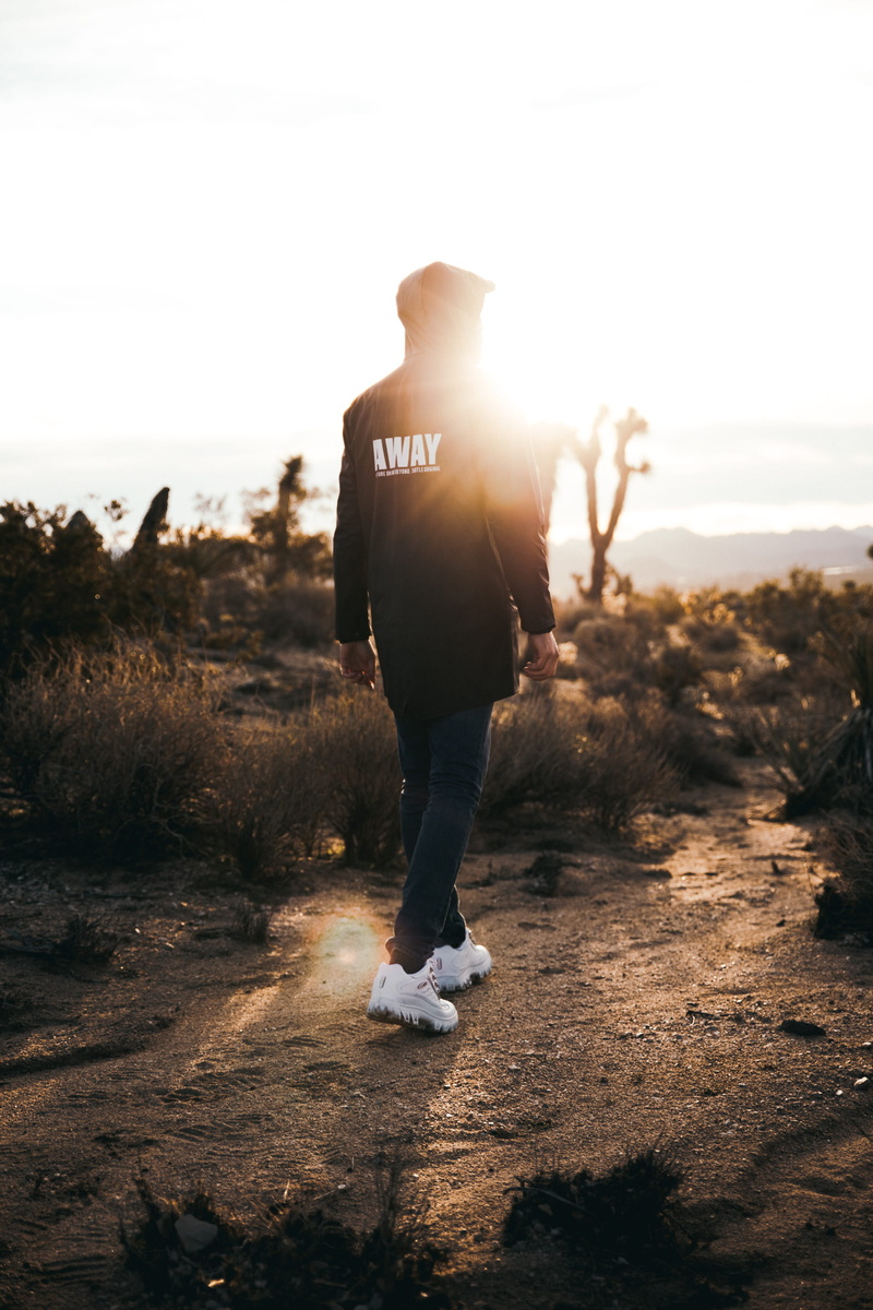 sky, light, clothing, rear view, shoe, footwear, long, human, dusk, standing, walking, lifestyles, apparel, nature, leisure activity, dawn, real people
