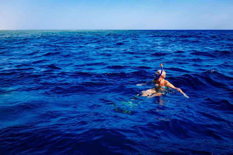 4K, horizon over water, snorkling, sea, jumping, water, leisure activity, waterfront, beauty in nature, sky, scenics - nature, blue, day, horizon, vertebrate
